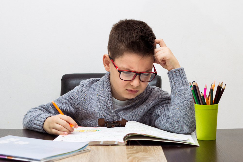 child struggling to focus while studying and memorizing Quran
